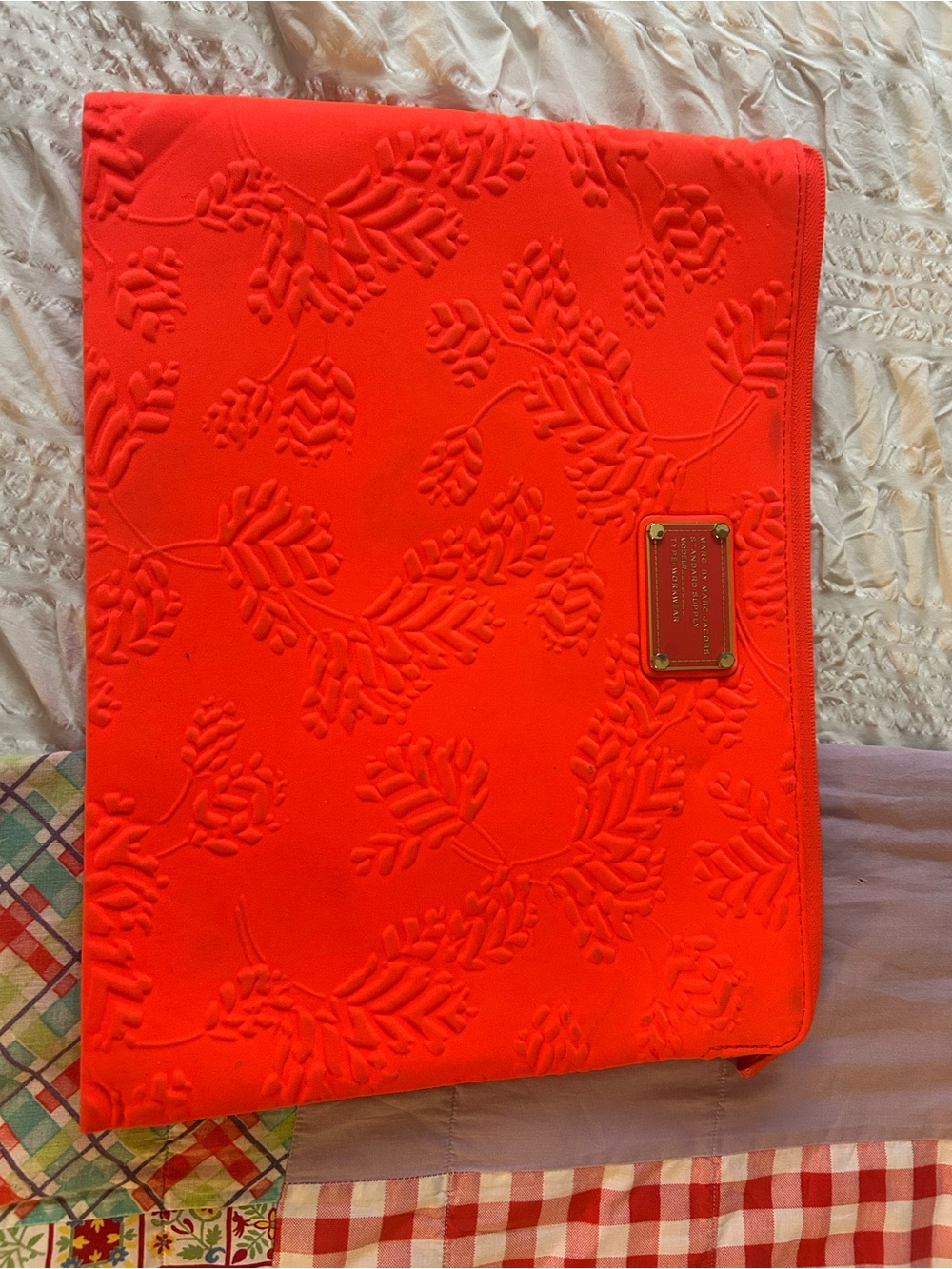 Marc Jacob’s Bright Coral Embossed Laptop Sleeve